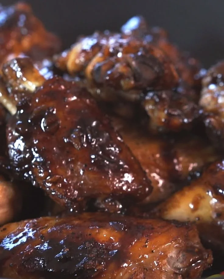 Delicious Chicken Adobo Wings served on a plate with herbs