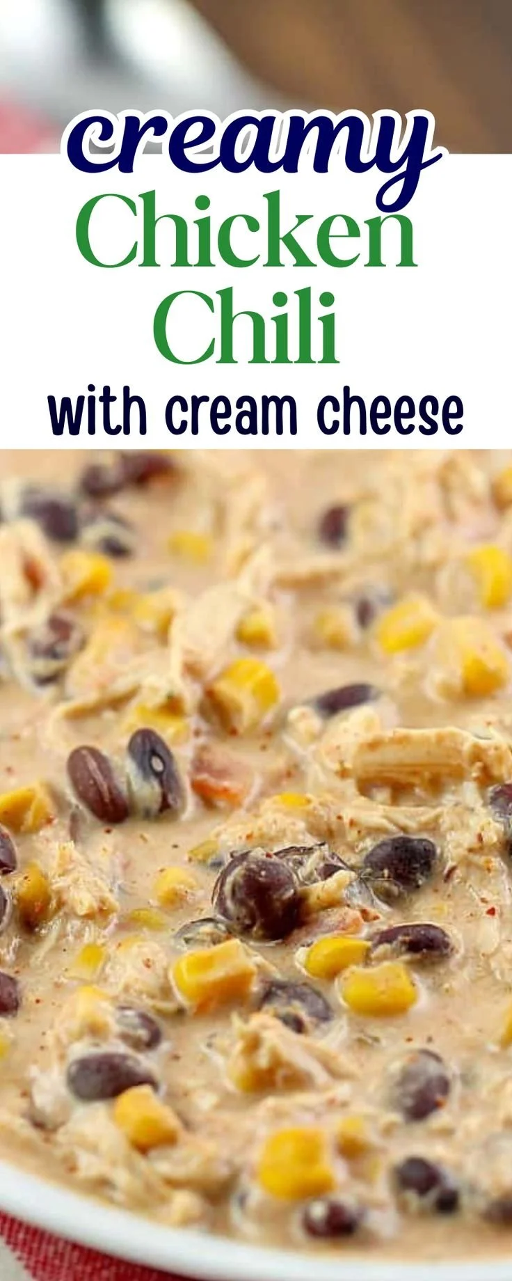 Bowl of creamy crockpot chicken chili with toppings, ready to serve.
