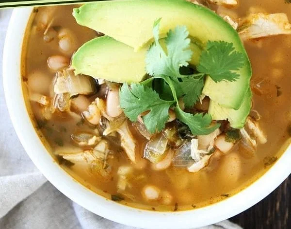 Bowl of easy white chicken chili garnished with cilantro