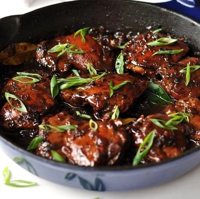 Delicious Filipino Chicken Adobo served with rice on a plate