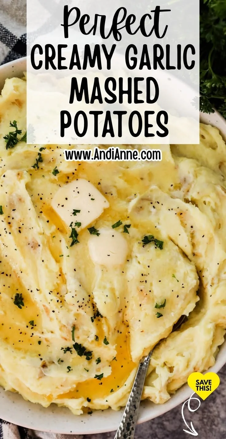 Bowl of creamy garlic mashed potatoes topped with herbs