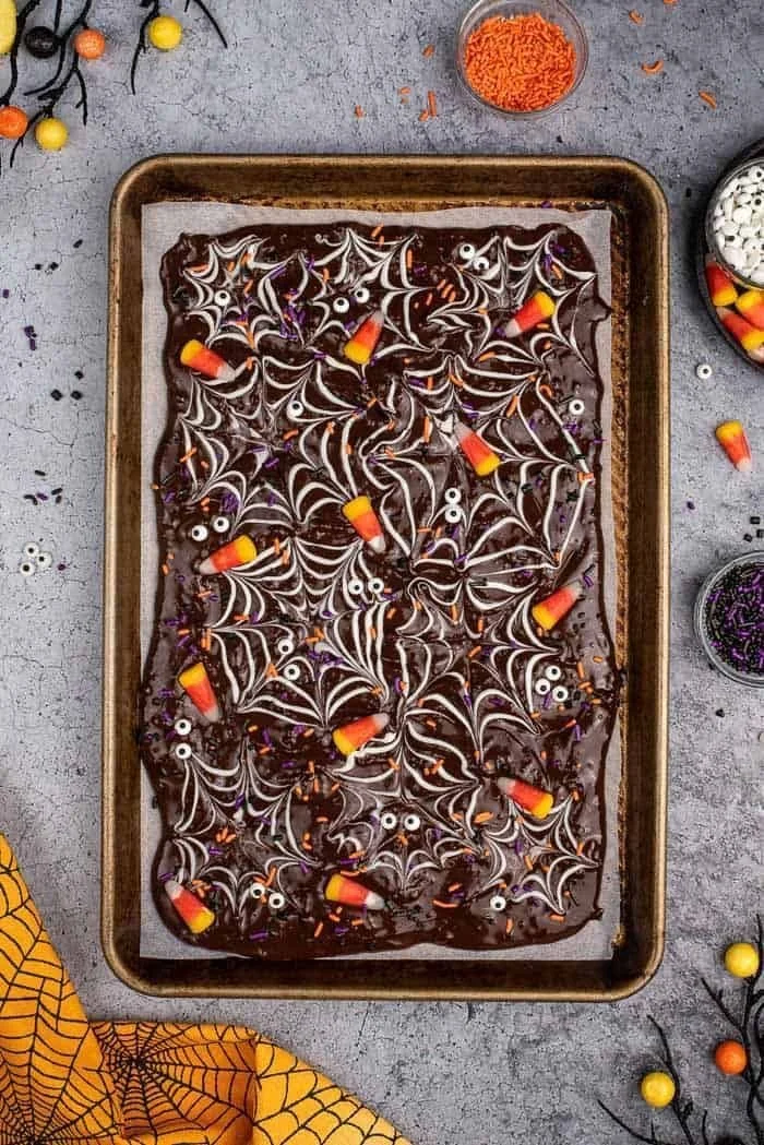 Halloween chocolate bark with colorful toppings, perfect for festive treats.