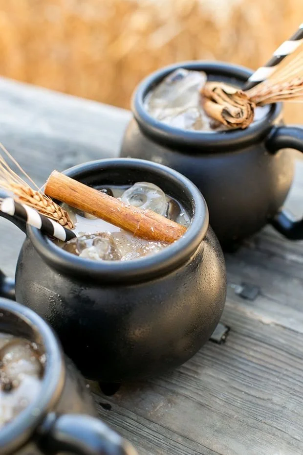 Halloween Coffee Punch in a spooky cauldron with festive decorations