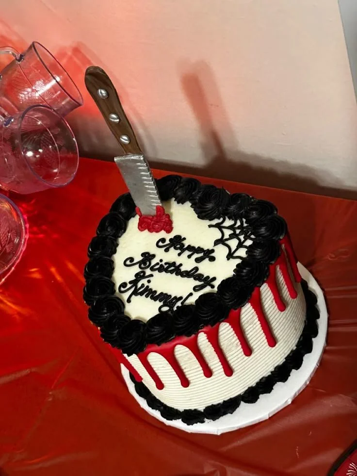 Halloween spooky birthday cake featuring ghosts and pumpkins
