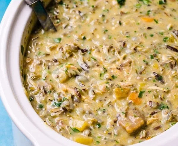 Healthy chicken wild rice soup with vegetables in a bowl