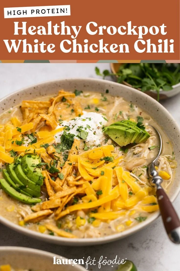 Healthy crockpot white chicken chili in a bowl topped with cilantro