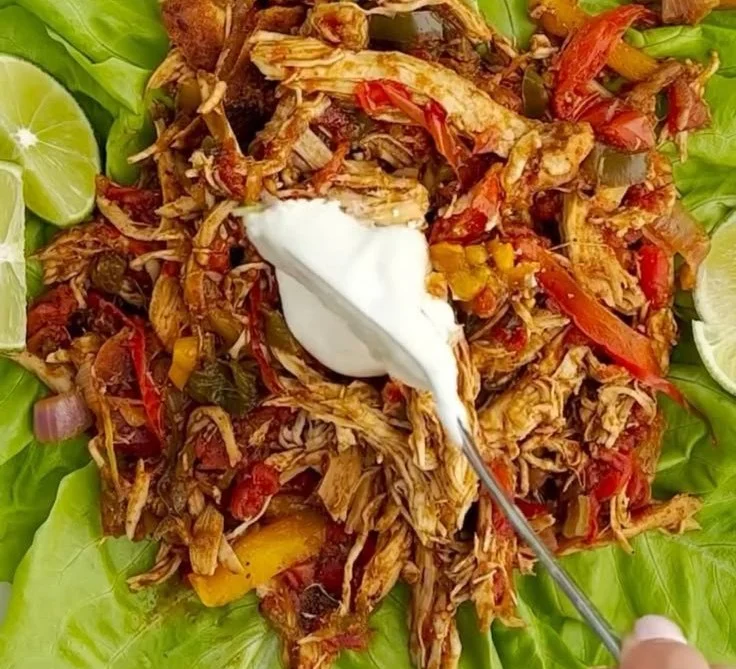 Instant Pot chicken fajitas being served with fresh toppings