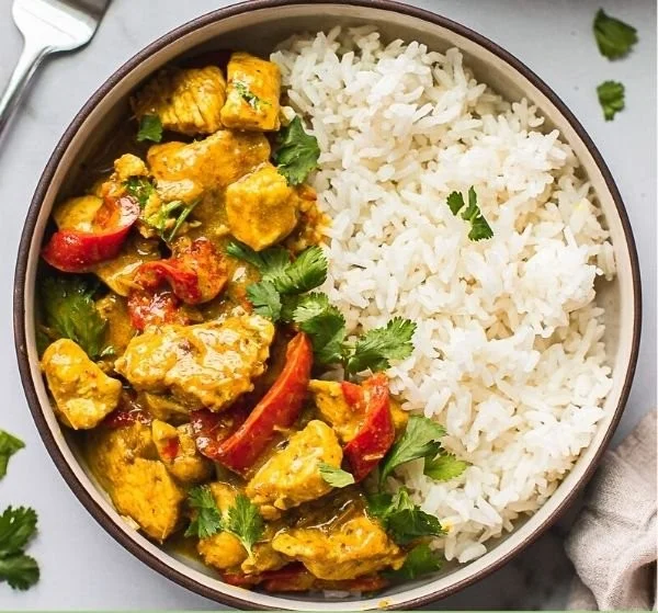 Delicious Instant Pot Thai Coconut Curry Chicken served with rice