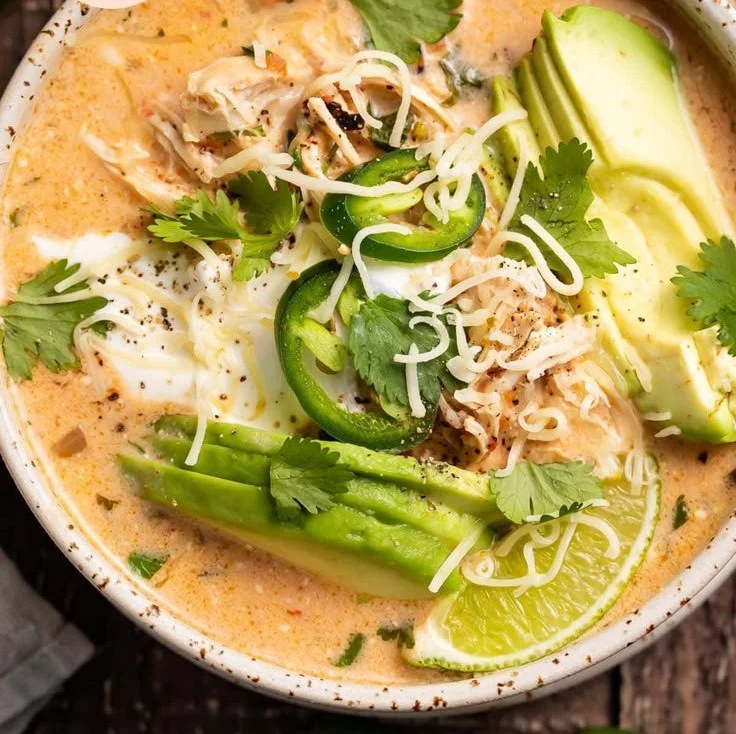 Bowl of Keto Chicken Tortilla Soup garnished with avocado and cilantro