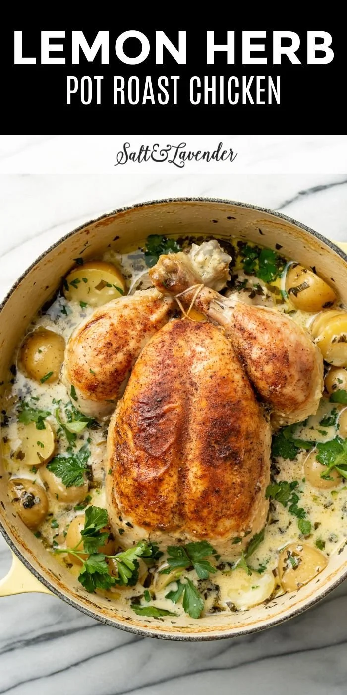 Lemon Herb Pot Roast Chicken served with fresh herbs and vegetables.