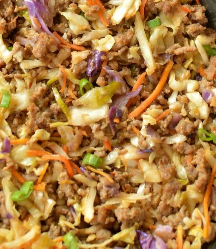 Low-Carb Egg Roll in a Bowl served with fresh vegetables and seasonings
