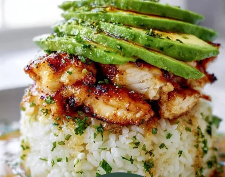 Delicious honey lime chicken served with fresh avocado and lime slices
