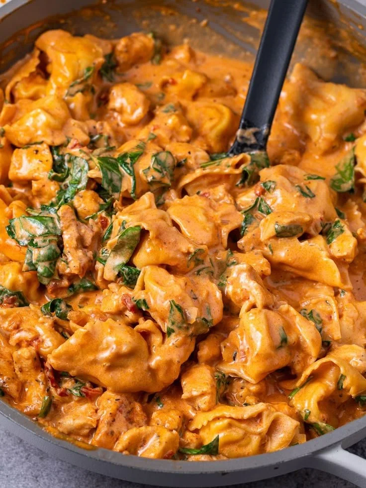 Delicious Marry Me Chicken Tortellini in a creamy sauce served in a pan