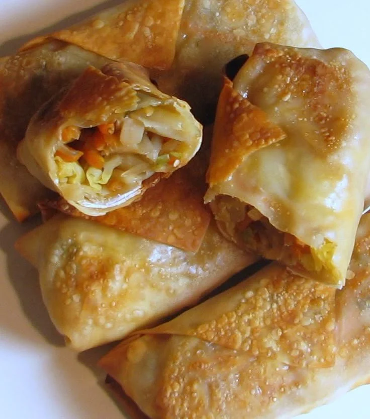Plate of golden Baked Vegetable Egg Rolls served with dipping sauce