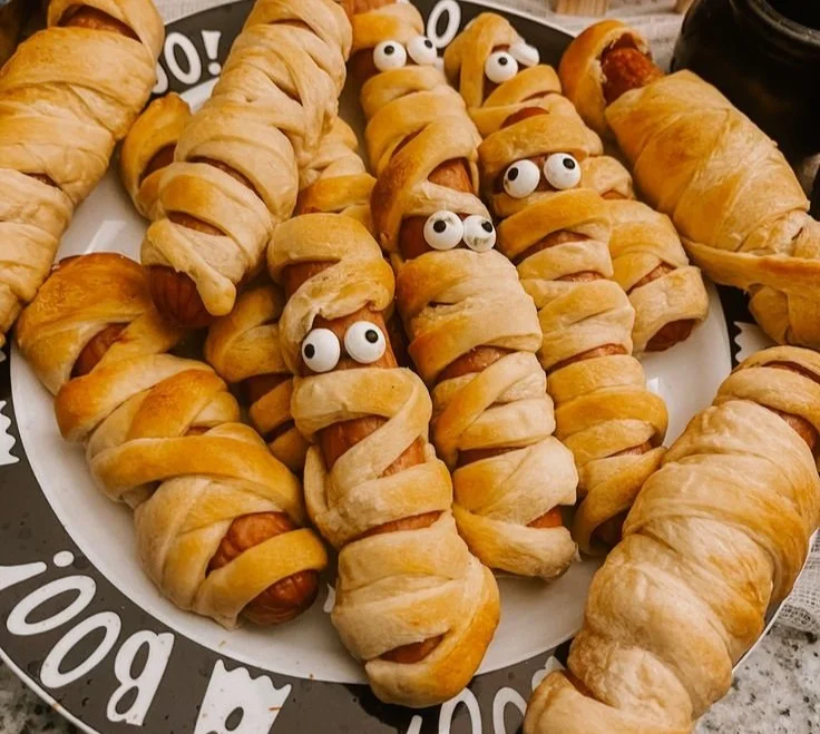 Mummy Dogs - Fun and spooky Halloween treats wrapped in crescent dough.