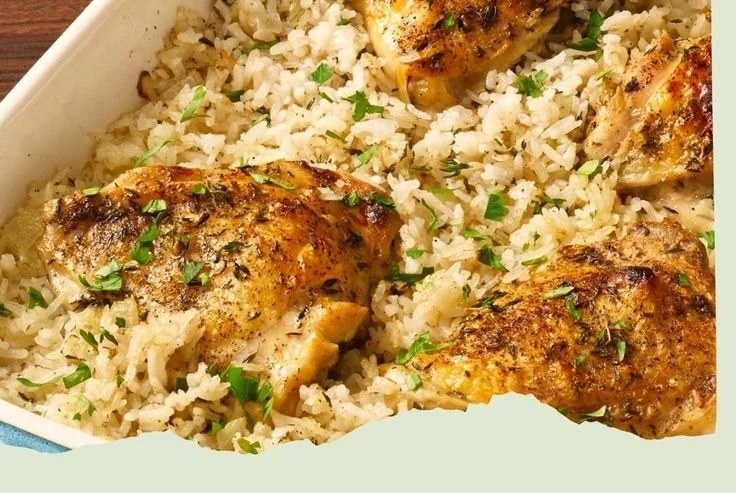 No-Peek Chicken and Rice Casserole topped with herbs and cheese