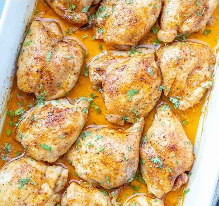 Deliciously crispy oven-baked chicken thighs served with herbs and spices