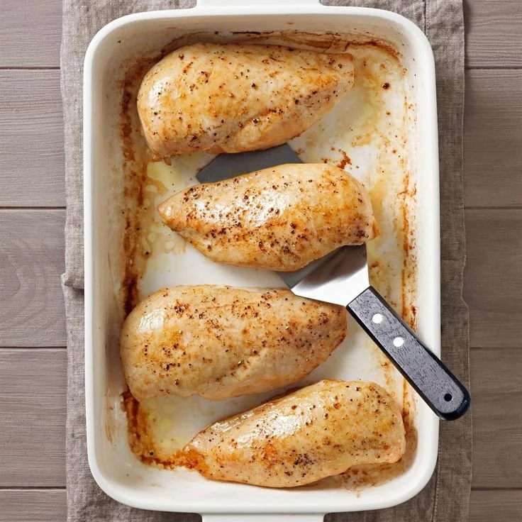 Deliciously seasoned oven-roasted chicken breast served on a plate.
