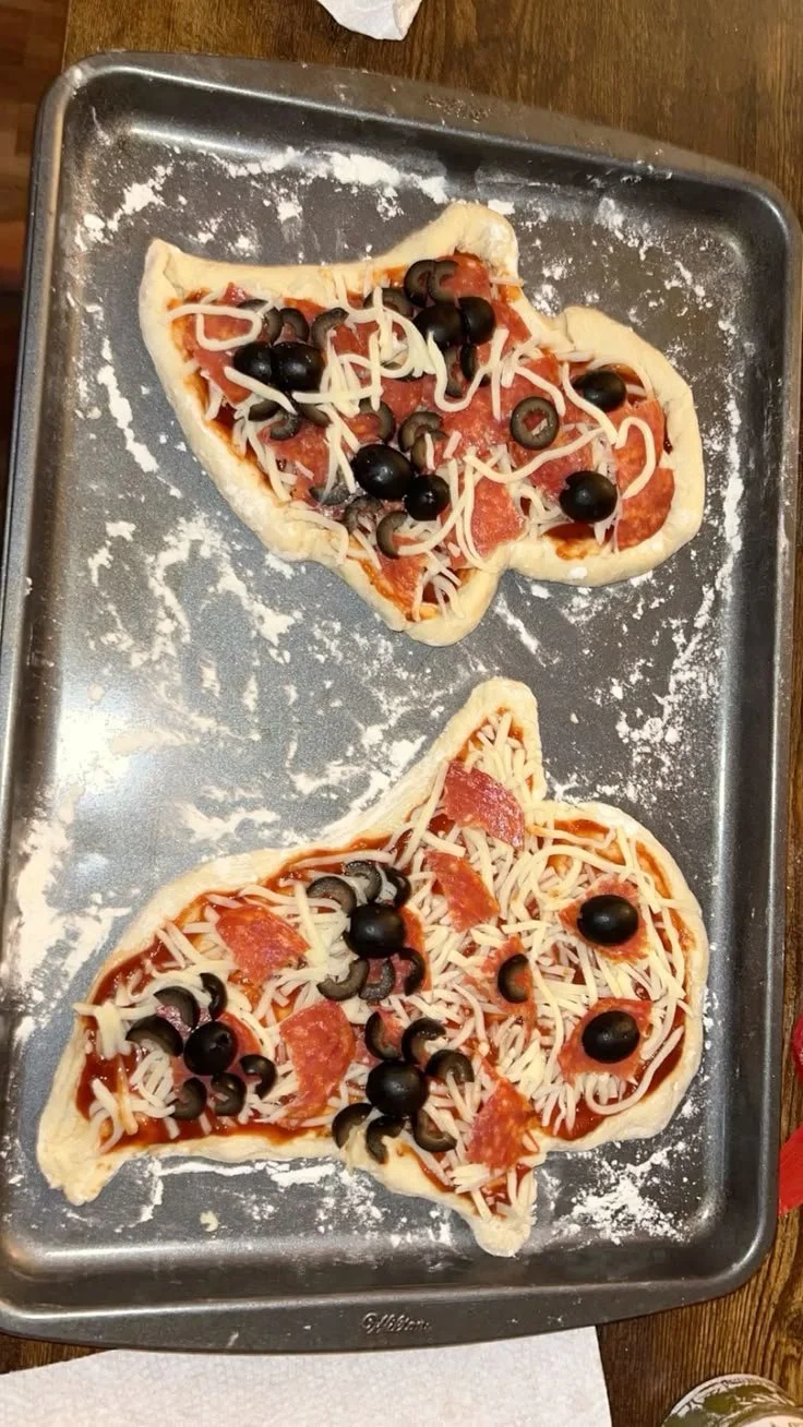 Spooky ghost-themed pizza for Halloween food celebration