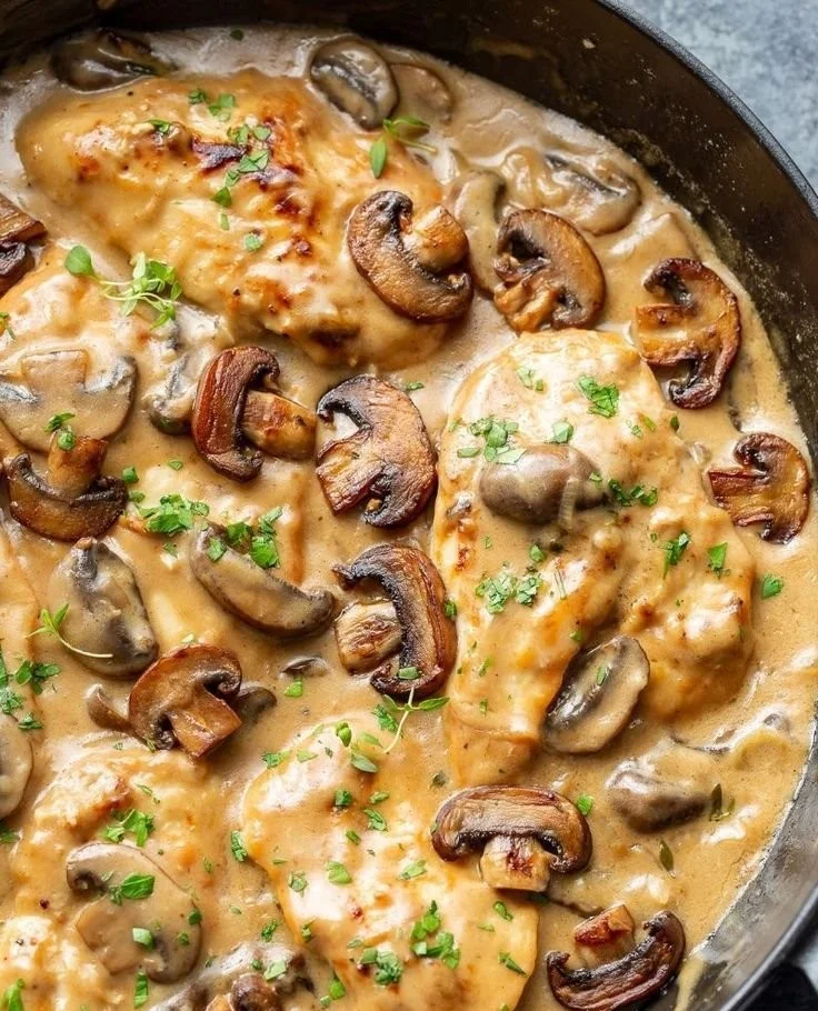 Skillet chicken and mushroom in wine sauce served on a plate