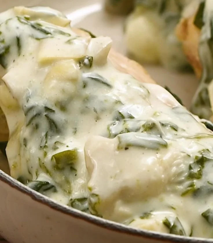 Slow cooker spinach artichoke chicken served in a bowl