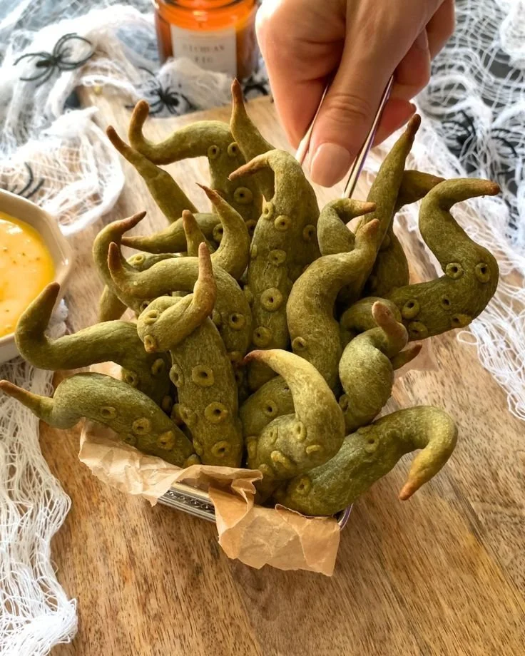 Halloween appetizer featuring sweet potato tentacles shaped for spooky theme