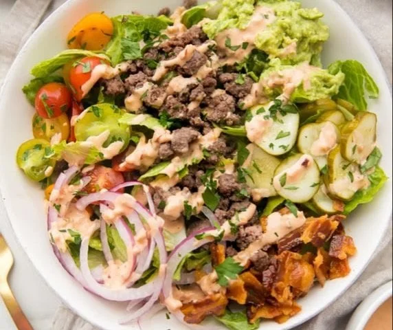 Whole 30 Burger Bowl filled with fresh vegetables and lean meat