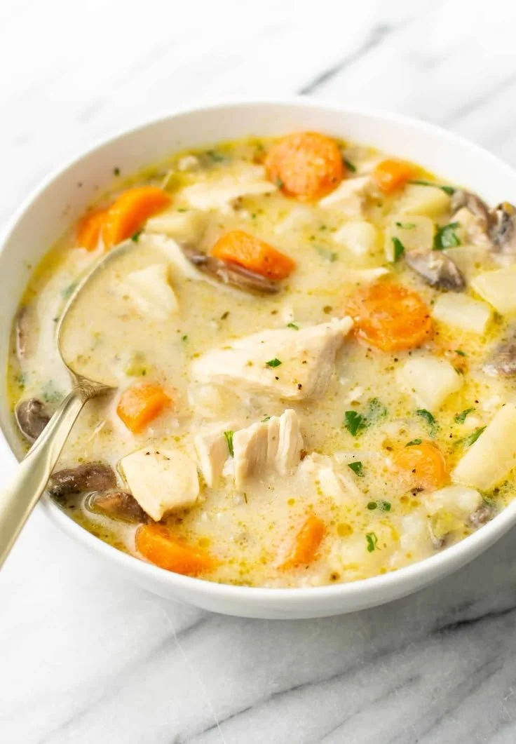 A warm bowl of the best chicken stew with vegetables and herbs