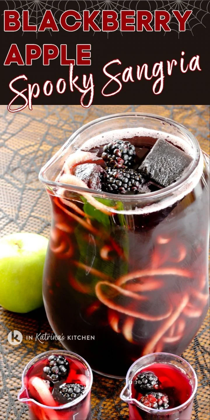 Blackberry apple spooky sangria in a glass with spiralized apples for Halloween