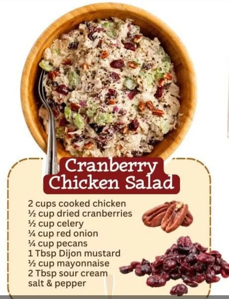 A delicious bowl of cranberry chicken salad with greens and cranraisins.