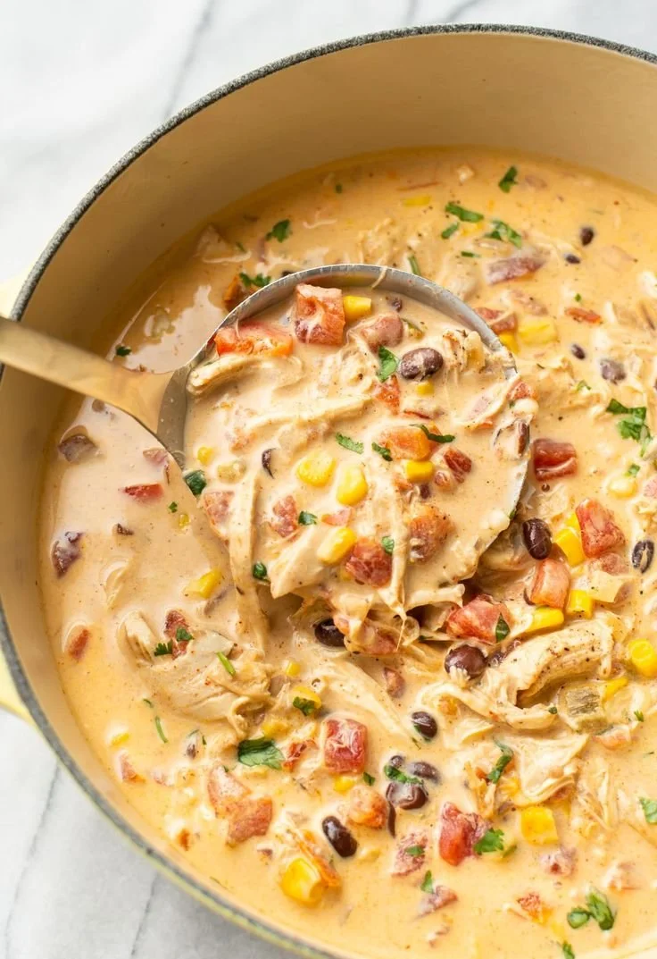 Delicious Chicken Taco Soup with Rotel, cream cheese broth, and spices.