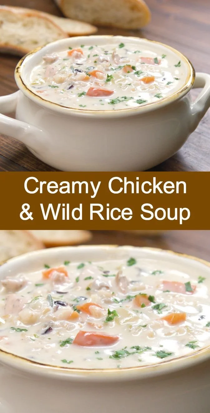 Bowl of creamy chicken and wild rice soup garnished with fresh herbs