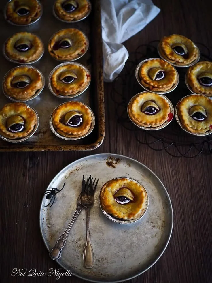 Spooky eyeball pies and creepy Halloween food for a hauntingly delicious celebration.