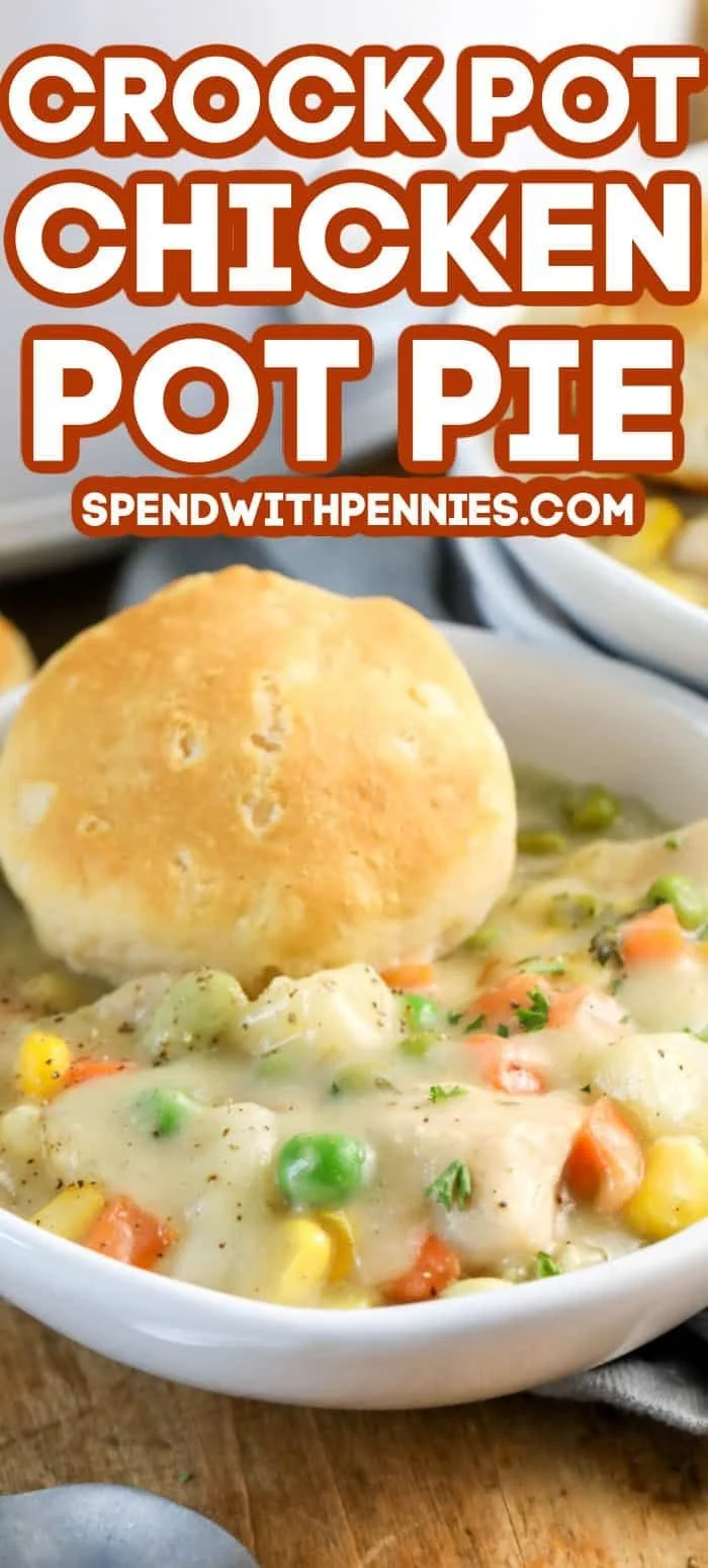 Crock pot chicken pot pie topped with golden crust in a slow cooker