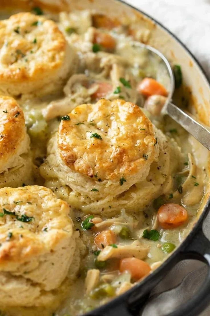 Homemade chicken pot pie with biscuits, a comforting and delicious meal.