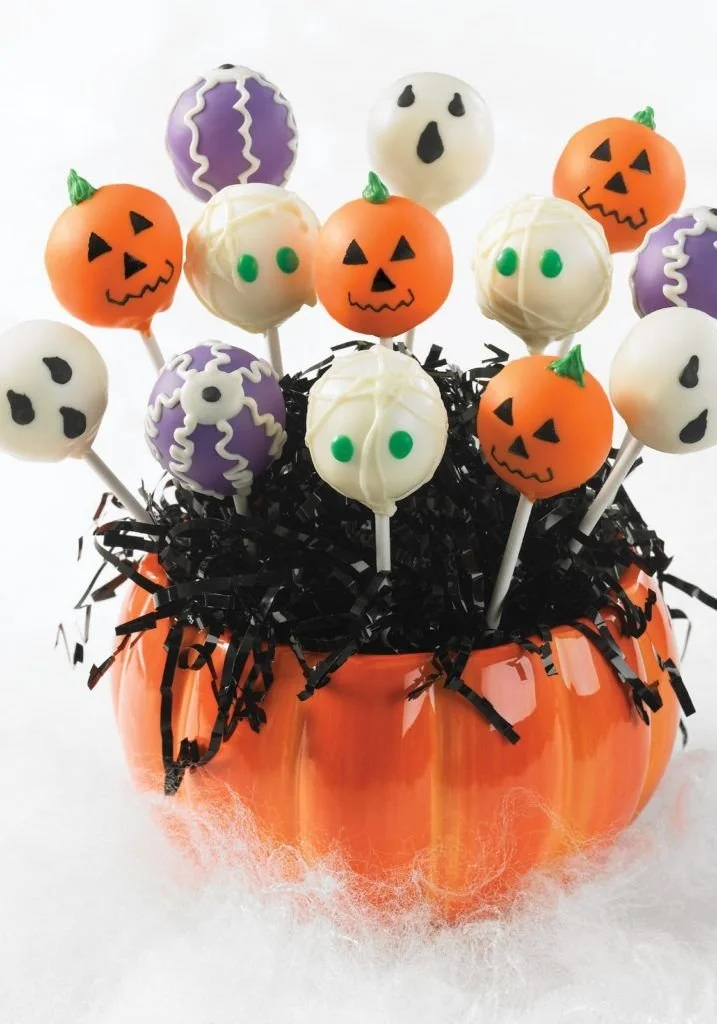 Decorative Halloween cake pops in various spooky designs.