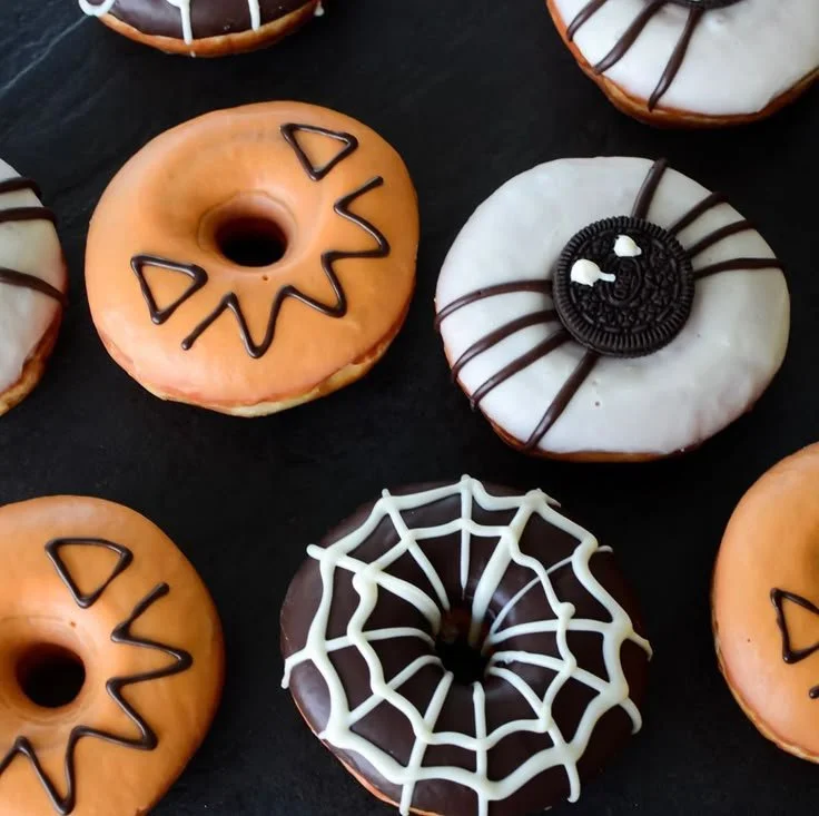 Halloween donut boxes filled with creative mini donuts for festive treats