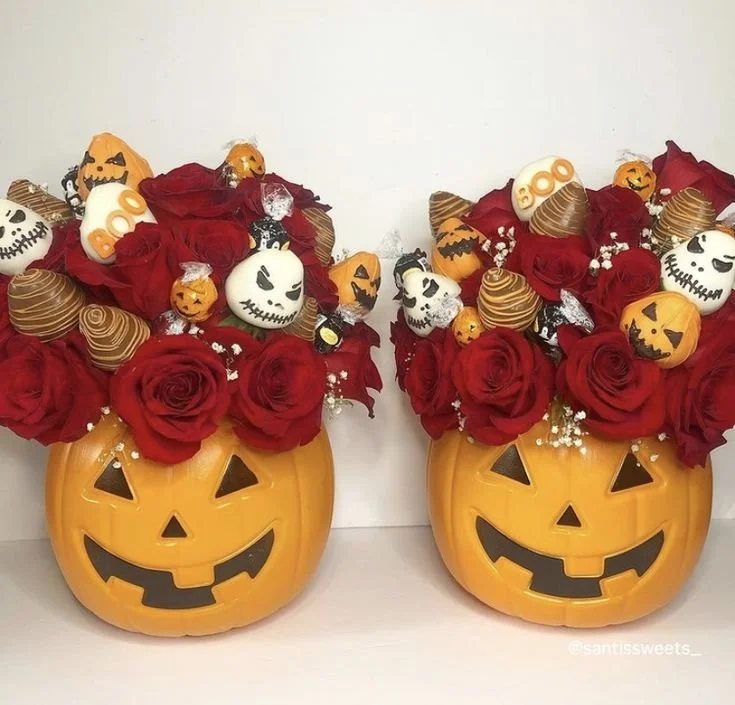 Halloween edible arrangements featuring cupcake bouquets and chocolate treats.
