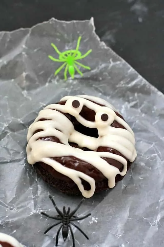 Gluten-free and vegan Halloween mummy donuts decorated for Halloween.