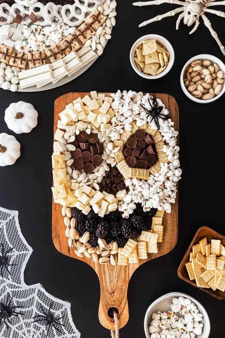 Spooky Halloween platter with themed finger foods and charcuterie ideas