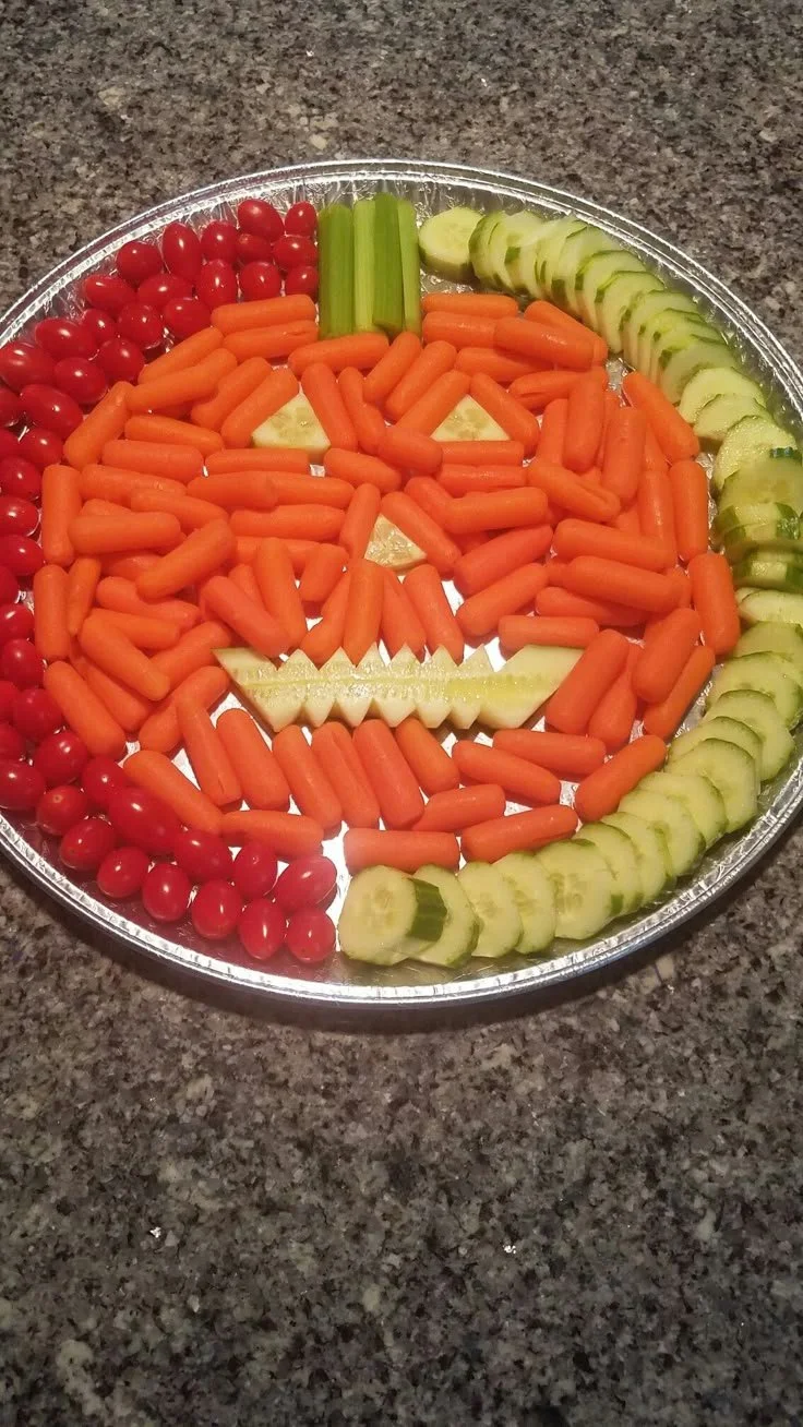 Colorful Halloween veggie tray with festive vegetables and spooky decorations