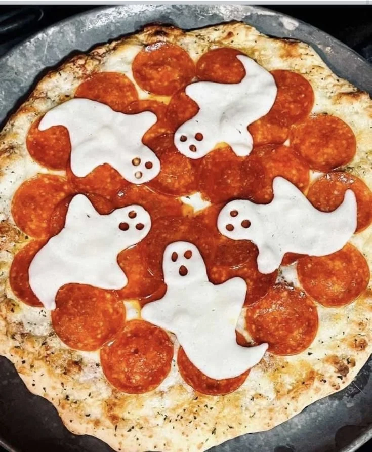 Haunted Mansion themed dinner setting with autumn decor and Halloween food