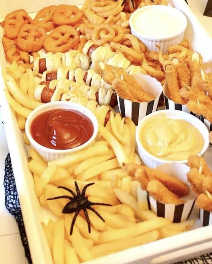 Kid-friendly Halloween tablescape featuring fun food ideas and decorations.