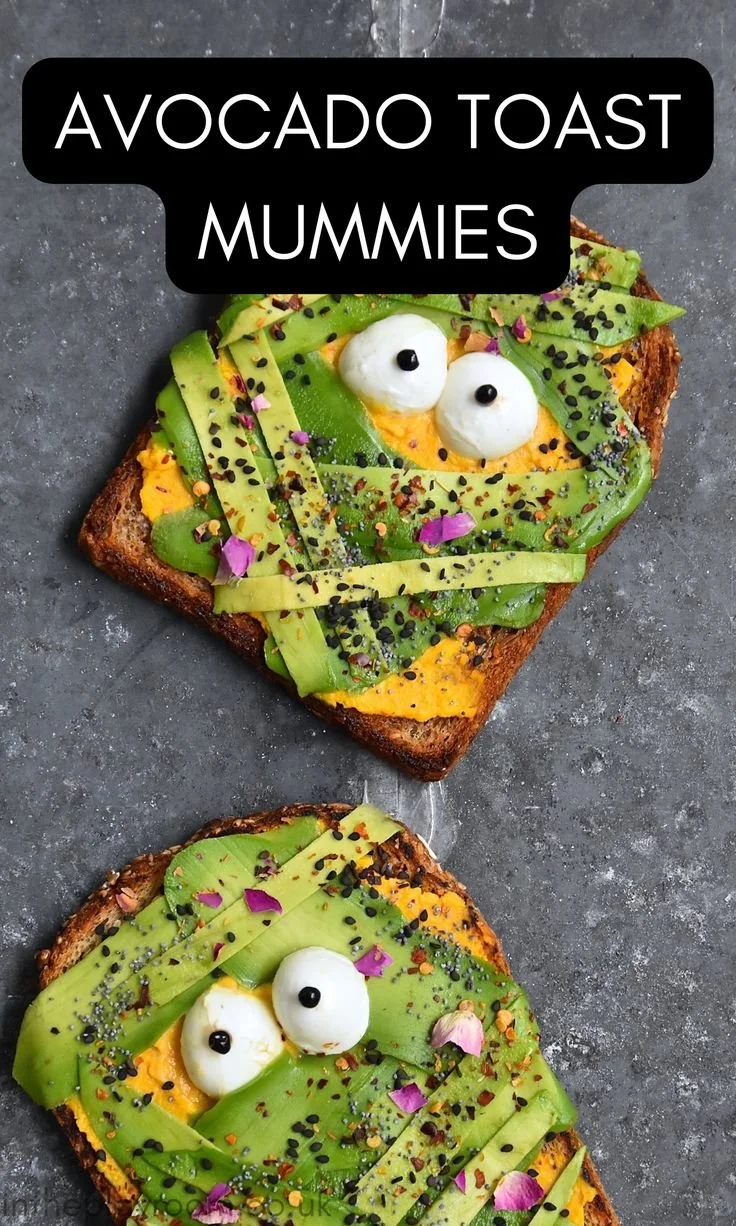 Mummy avocado toast decorated for Halloween with spooky details and fall themes