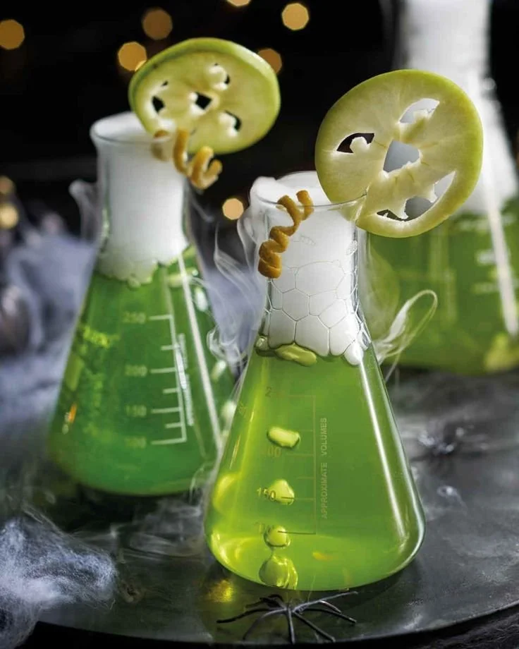 Poison Apple-tini recipe for Halloween party with science lab decorations.