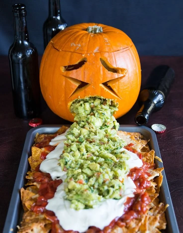 Delicious Halloween pumpkin nachos served on a festive platter.