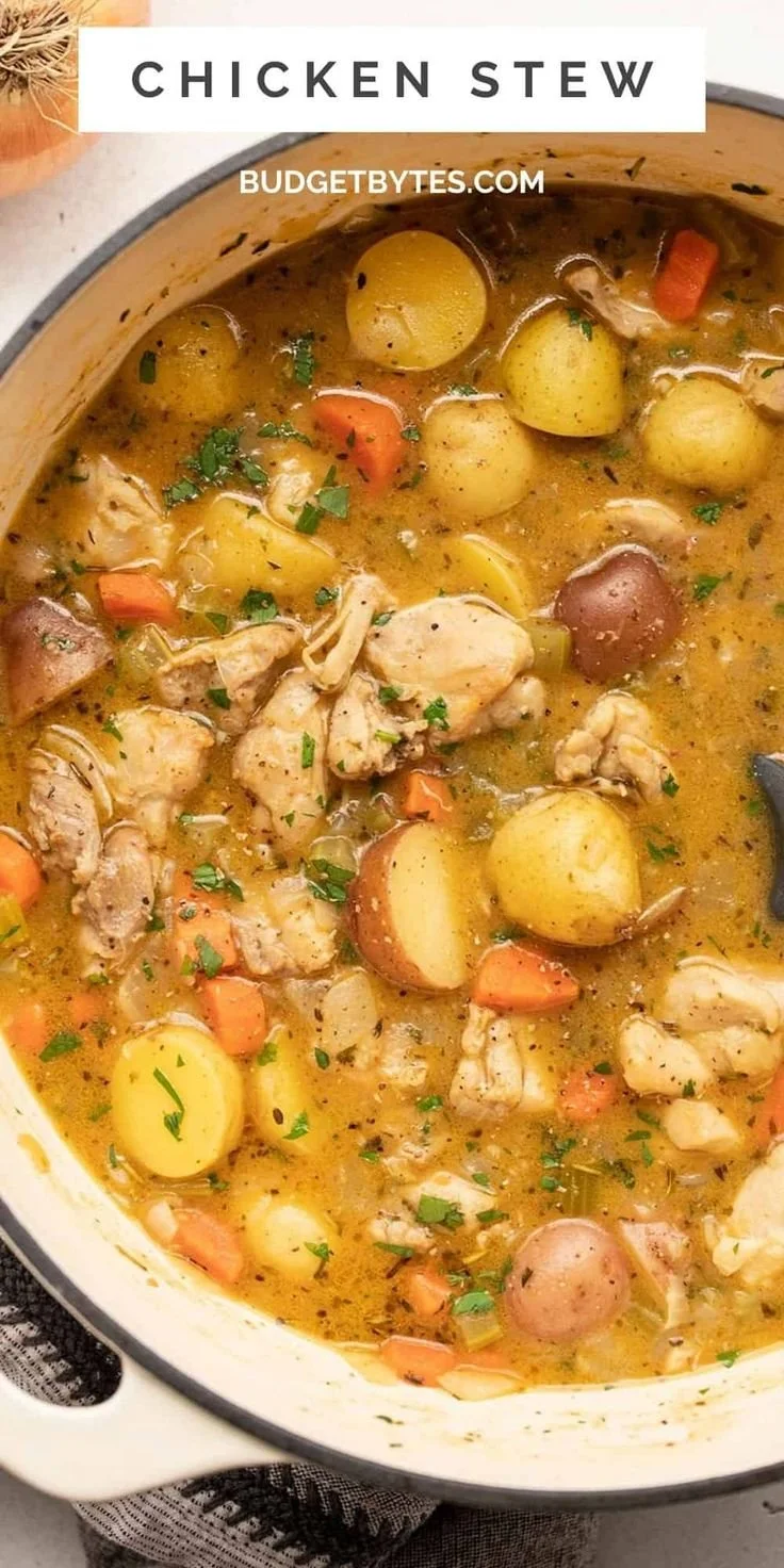 Bowl of rich and hearty chicken stew with vegetables, perfect for cozy dinners.