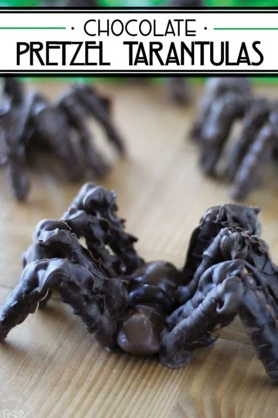 Delicious chocolate tarantulas for Halloween, made with chocolate and pretzels.