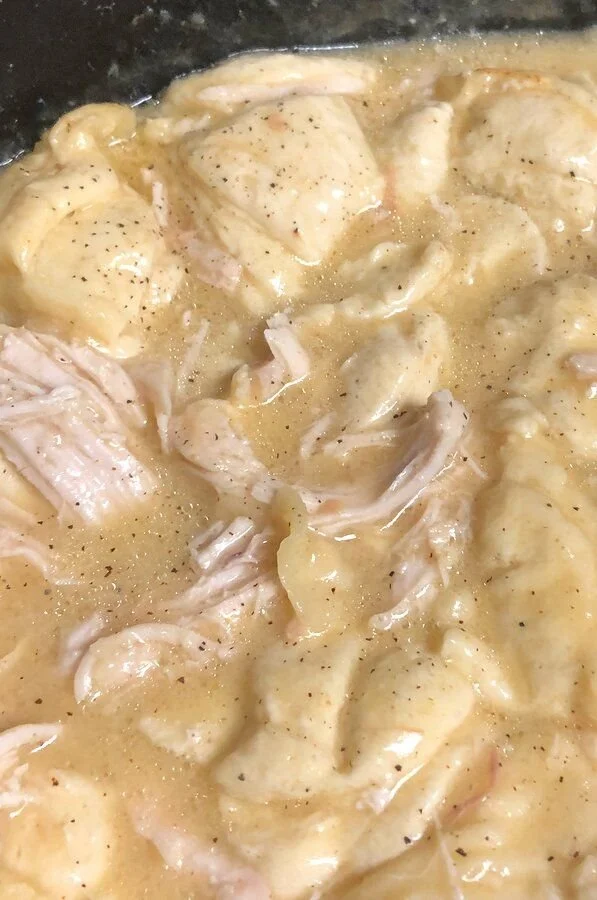 Delicious slow cooker chicken and dumplings in a bowl ready to serve.