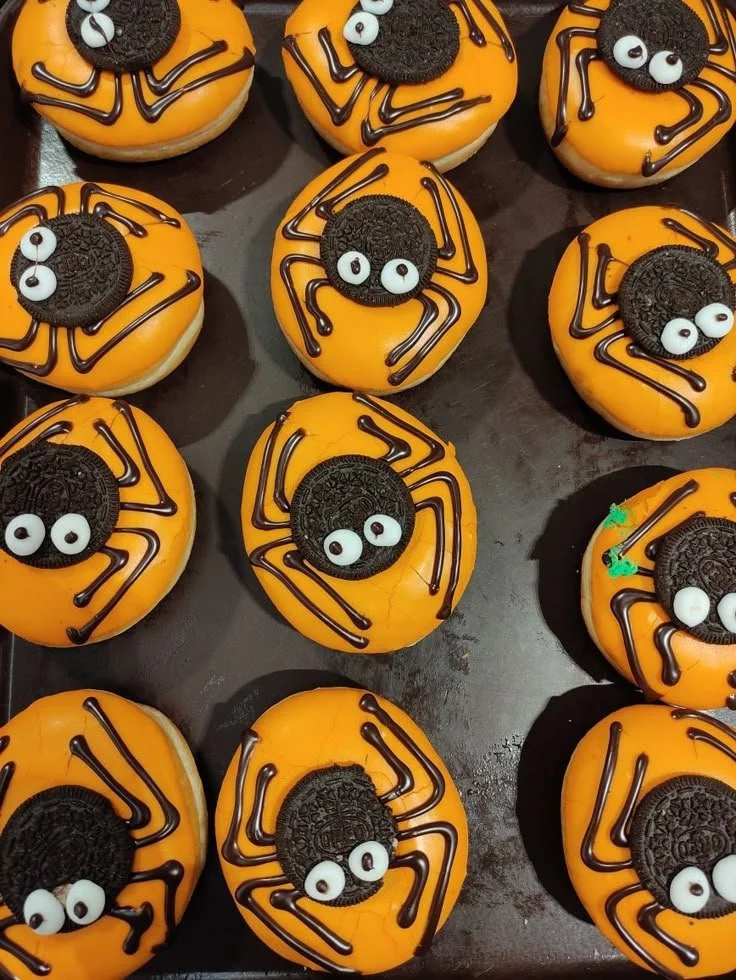 Deliciously spooky spider donut topped with chocolate and candy eyes